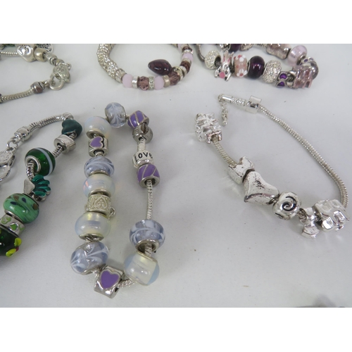 209 - SELECTION OF FASHION CHARM BRACELETS AND NECKLACES