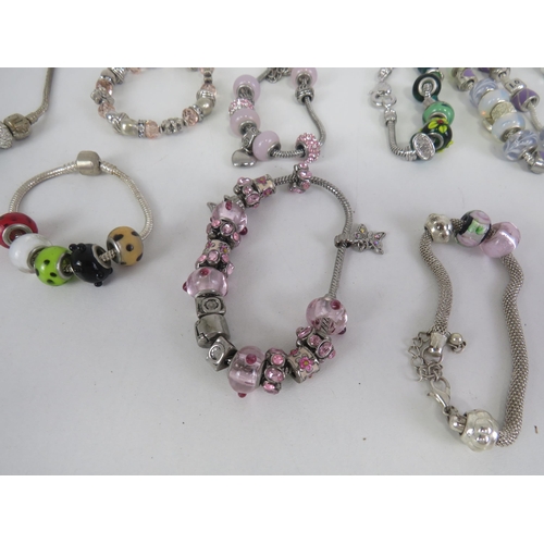 209 - SELECTION OF FASHION CHARM BRACELETS AND NECKLACES