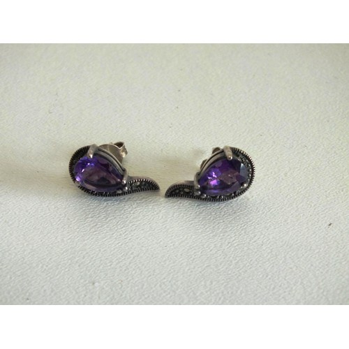 83 - CARVED AMETHYST PENDANT SET IN 925 SILVER MOUNT AND PAIR OF 925 SILVER MARCASITE AND AMETHYST EARRIN... 