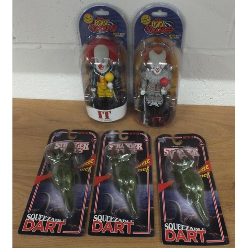 48 - 2x NECA BODY KNOCKERS OF PENNYWISE AND 3x STRANGER THINGS SQUEEZABLE DARTS - ALL BOXED AS NEW