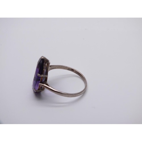 77 - 18CT WHITE GOLD AMETHYST RING