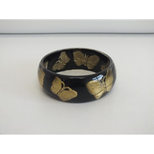 46 - 1950's REVERSE CARVED BUTTERFLY BANGLE