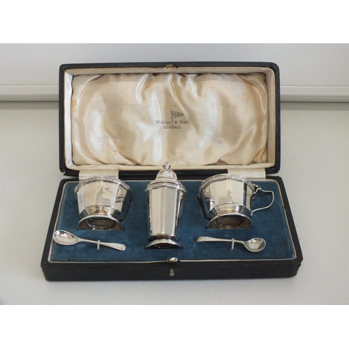 22 - WALKER AND HALL STERLING SILVER CASED CONDIMENT SET COMPRISING OF SALT, PEPPERETTE, MUSTARD  POT AND... 