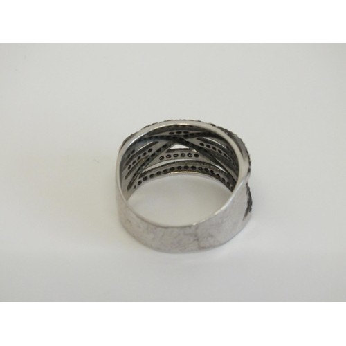 43 - LARGE STERLING SILVER BLACK STONE CROSSOVER RING SIZE V
