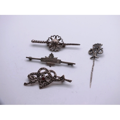 4 - 4 x SILVER BROOCHES INCLUDING CANADA, TWO SCOTTISH and ONE RED STONE