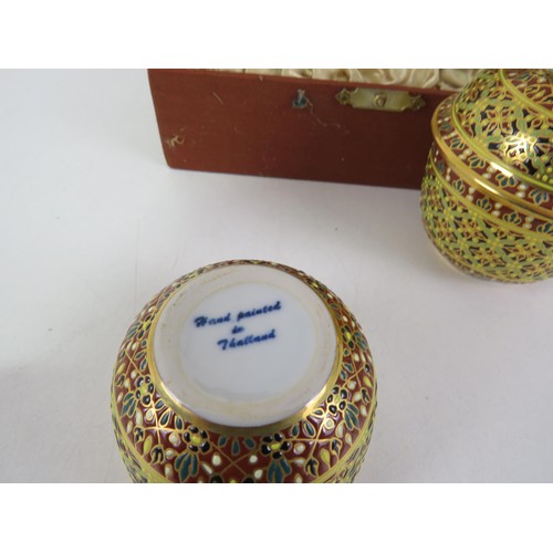 215 - PAIR OF BOXED THAILAND BENJARONG DECORATIVE 18 & 12K GILT HAND PAINTED LIDDED POTS