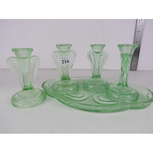 216 - ART DECO GREEN PRESSED GLASS DRESSER TRAY and FOUR CANDLESTICKS