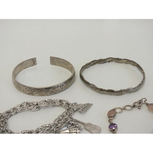100 - FOUR SILVER BRACELETS/BANGLES INCLUDES CHINESE SILVER CUFF BANGLE, SILVER CHARM BRACELET, GEMSTONE &... 