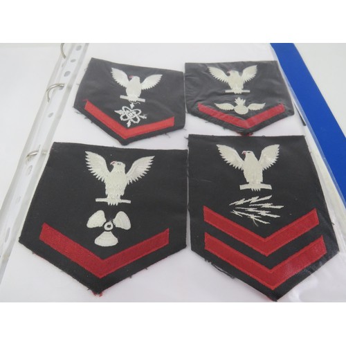 151 - ALBUM OF US NAVY CLOTH BADGES