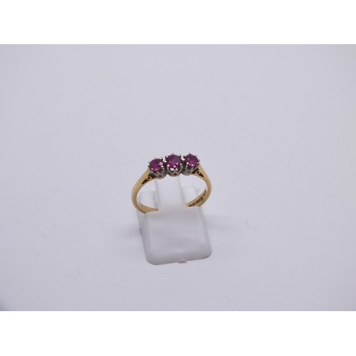 145 - 18ct GOLD RUBY TRILOGY RING SIZE O, 2.7g