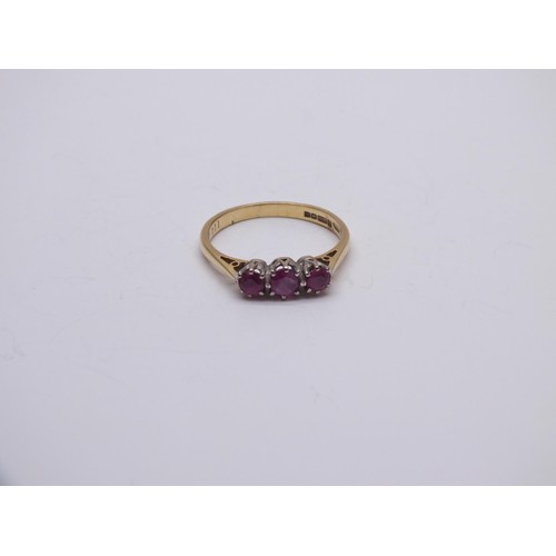 145 - 18ct GOLD RUBY TRILOGY RING SIZE O, 2.7g