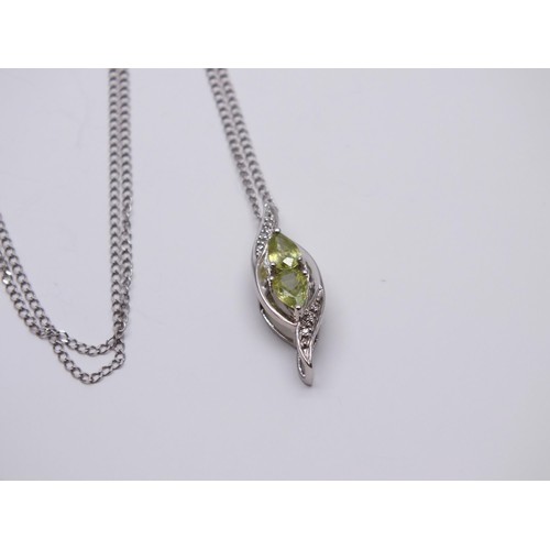 148D - 9ct WHITE GOLD PERIDOT PENDANT 16