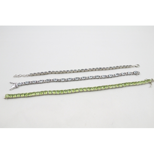 12 - Three silver gemstone tennis bracelets including Peridot