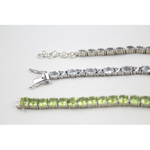 12 - Three silver gemstone tennis bracelets including Peridot