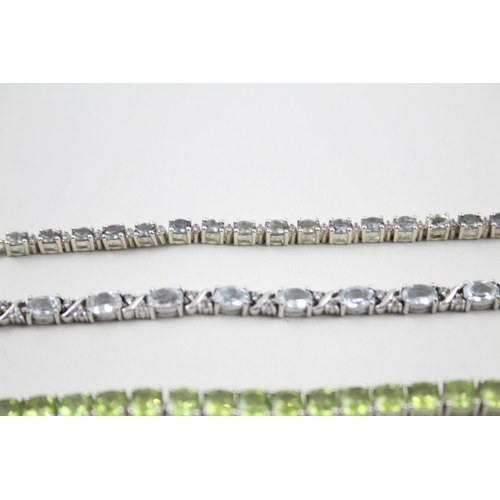 12 - Three silver gemstone tennis bracelets including Peridot