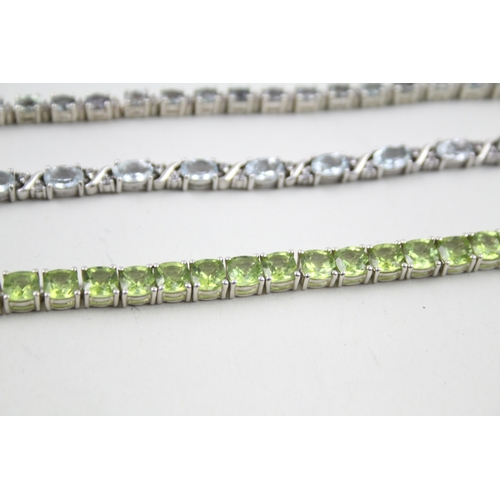 12 - Three silver gemstone tennis bracelets including Peridot