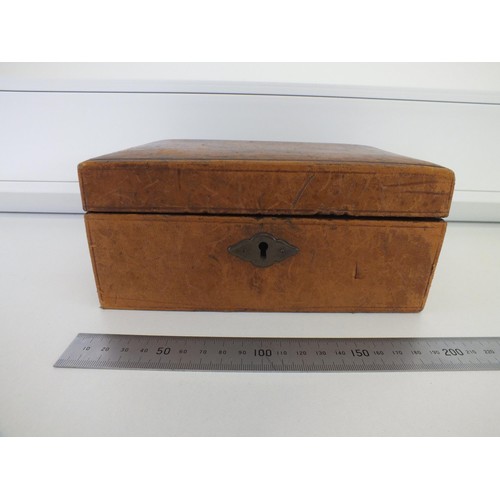 84A - LEATHER BOX OF COLLECTABLES, TRINKETS, JEWELLERY etc