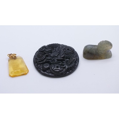 70 - CHINESE CARVED BLACK GREEN JADE PENDANT, CARVED JADE ANIMAL & AMBER GLASS CARVED CHINESE DRAGON PEND... 