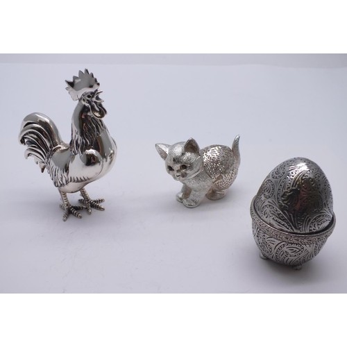 66 - CHRISTOFLE FRANCE LUMIERE CAT, PEWTER EGG PIN CUSHION & WHITE METAL COCKEREL FIGURE