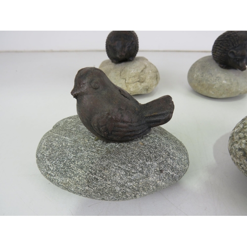 438 - CAST IRON BIRDS AND HEDGEHOGS ON PEBBLES