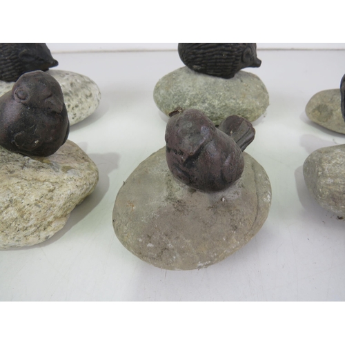 439 - CAST IRON BIRDS AND HEDGEHOGS ON PEBBLES