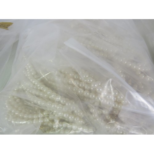 388 - FIVE BAGS OF FAUX PEARL NECKLACES