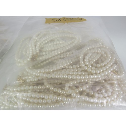 389 - FIVE BAGS OF FAUX PEARL NECKLACES