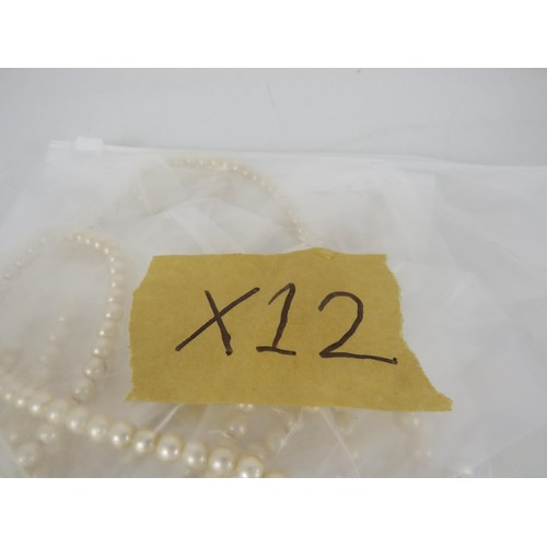 389 - FIVE BAGS OF FAUX PEARL NECKLACES