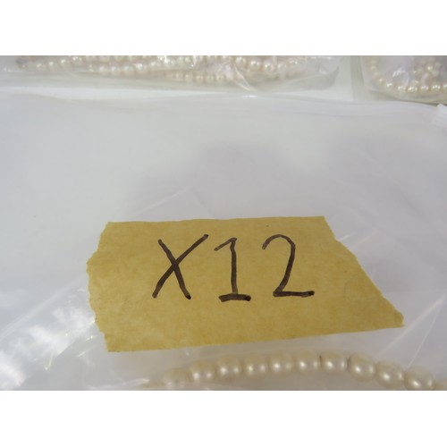 389 - FIVE BAGS OF FAUX PEARL NECKLACES