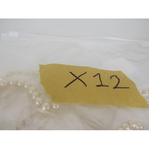 401 - FIVE BAGS OF FAUX PEARL NECKLACES