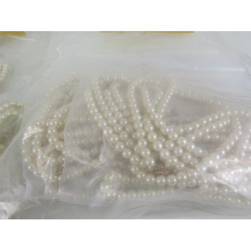 401 - FIVE BAGS OF FAUX PEARL NECKLACES