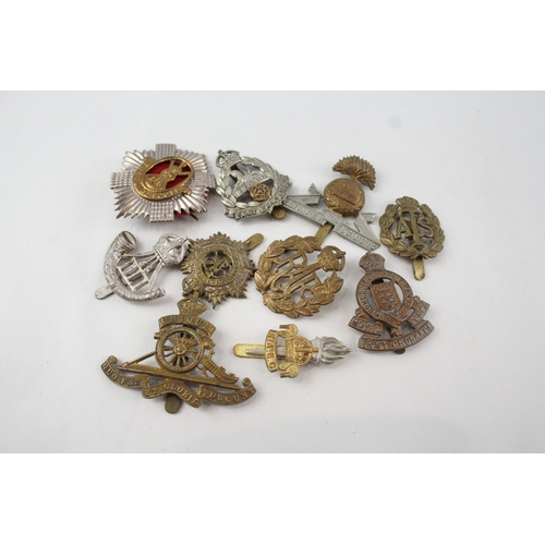 529 - Military/Cap Badges x 10 inc. East Lancs, Royal Scots, Lancashire, Fusiliers Etc