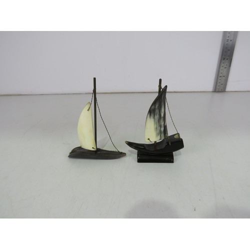 5 - Pair of carved horn sailing boat sculptures.
