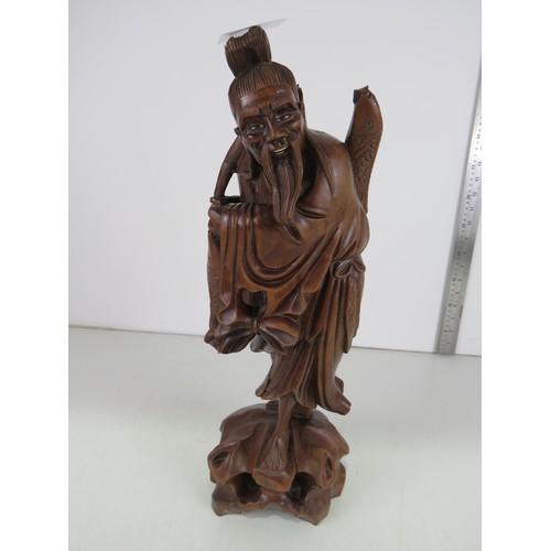 8 - Large carved rosewood Chinese man sculpture.