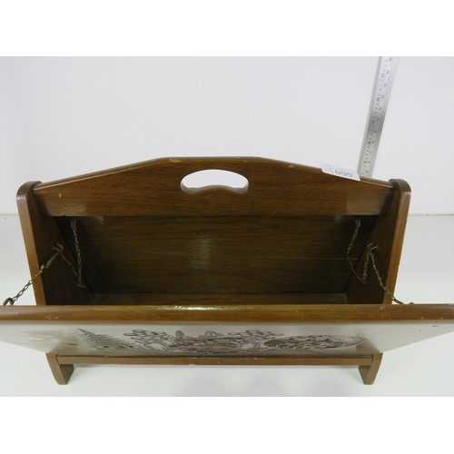 9 - Wooden magazine rack with oriental carved detail.