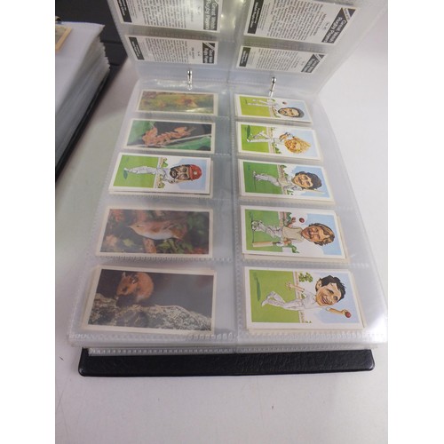 116 - Two albums of trading cards - 38 complete sets.