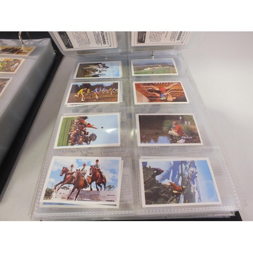 117 - Two albums of trade cards - 32 complete sets.