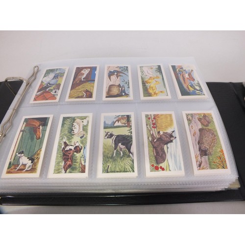 118 - Four albums of trade cards - seventy three complete sets.