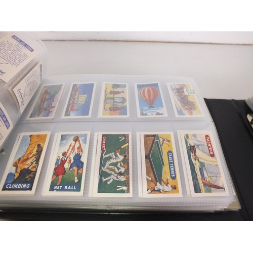 118 - Four albums of trade cards - seventy three complete sets.