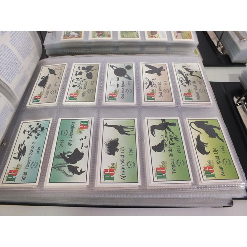 118 - Four albums of trade cards - seventy three complete sets.