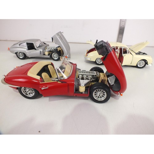 106 - Three Jaguar cars 1:18 scale.