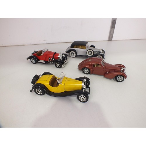 108 - Four vintage cars 1:24 scale.