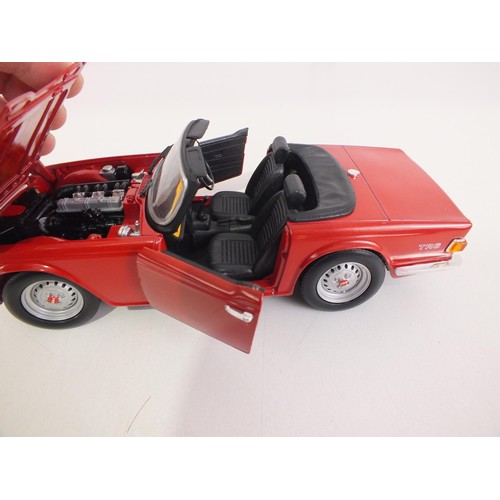 110 - Three vintage cars 1:18 scale.