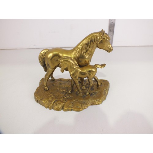 114 - Brass horse and foal.