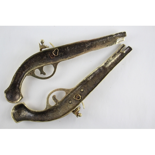 459 - Pair of ornamental brass flintlock pistols.