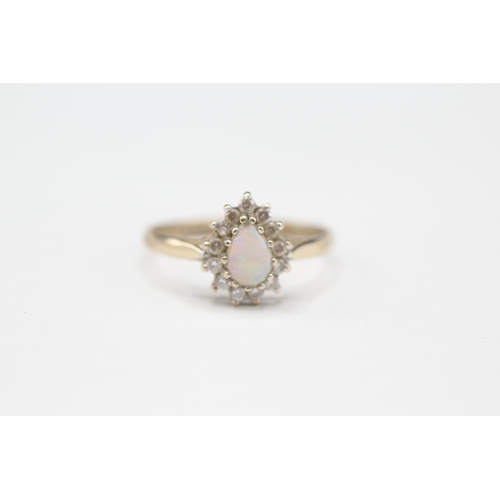 510 - 9ct gold opal and cubic Zirconia halo set ring (1.5g) size P.