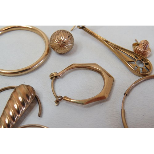 11 - 9ct Gold earrings singles and one pair of hoops.
Weight 8.2g