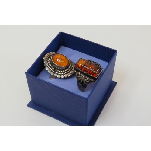 13 - Two vintage 925 silver and Amber rings.