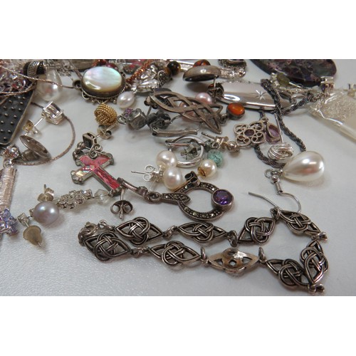 31 - Job lot of Silver Jewellery to include earrings, Necklaces, Pendants etc.
Weight 176g