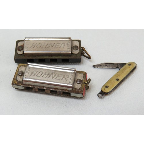 64 - Two miniature Horner Harmonica and miniature penknife.